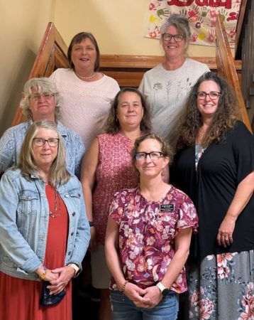 All of the VI Outreach standing together in a staircase.